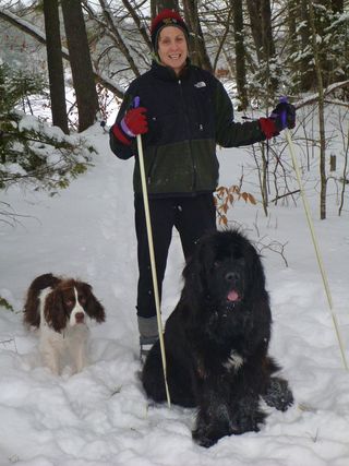 Patty skiing with her dogs at her camp in Norridgewock.