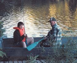 Beth fishing with her Grampa Dimond in Echo Lake in Fayette in 1986.