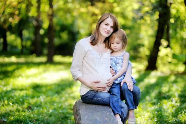 pregnant mom and child outdoors