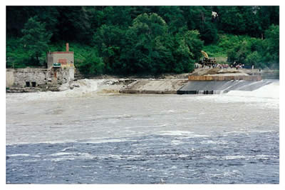 For the first time in more than 100 years, water flow freely past the site of the Edwards Dam on July 1, 1999. Ten years later, the river has been "reborn."