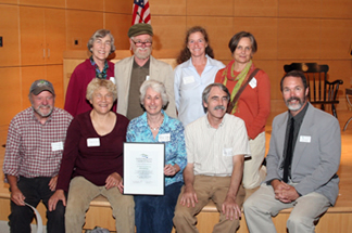 NRCM Board President Bill Houston (far right) presents the 2011 People's Choice Award to members of the Belfast Co-housing and Ecovillage community.
