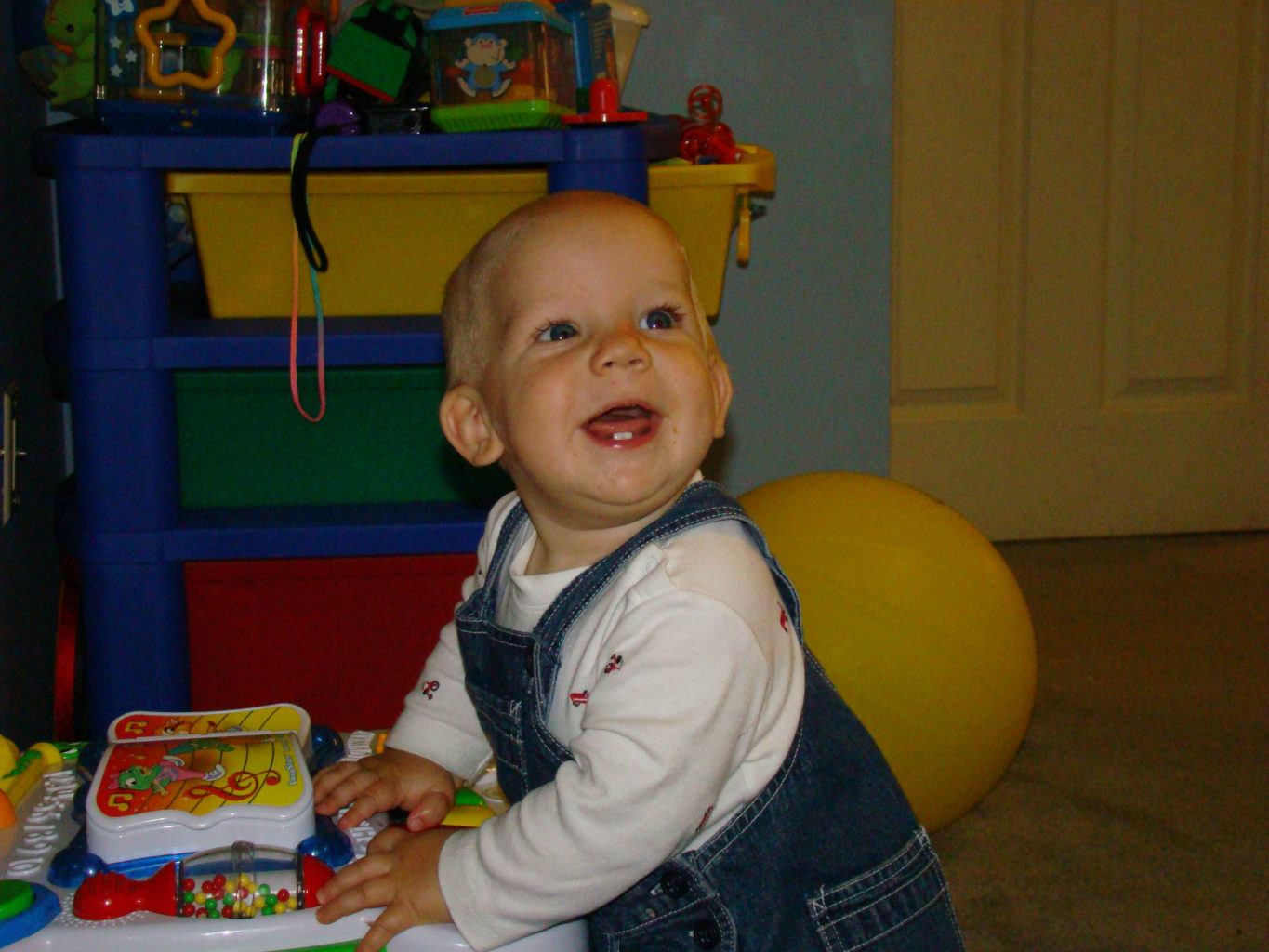 child with plastic toys