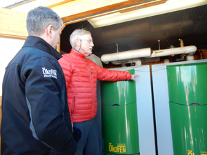 Senator King takes a closer look at the wood pellet boiler put in by Maine Energy Systems.