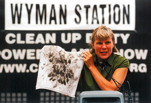 Carol Bass with handkerchief at Wyman press conference 2001