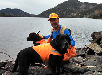 My dogs and I at Deboullie Pond.