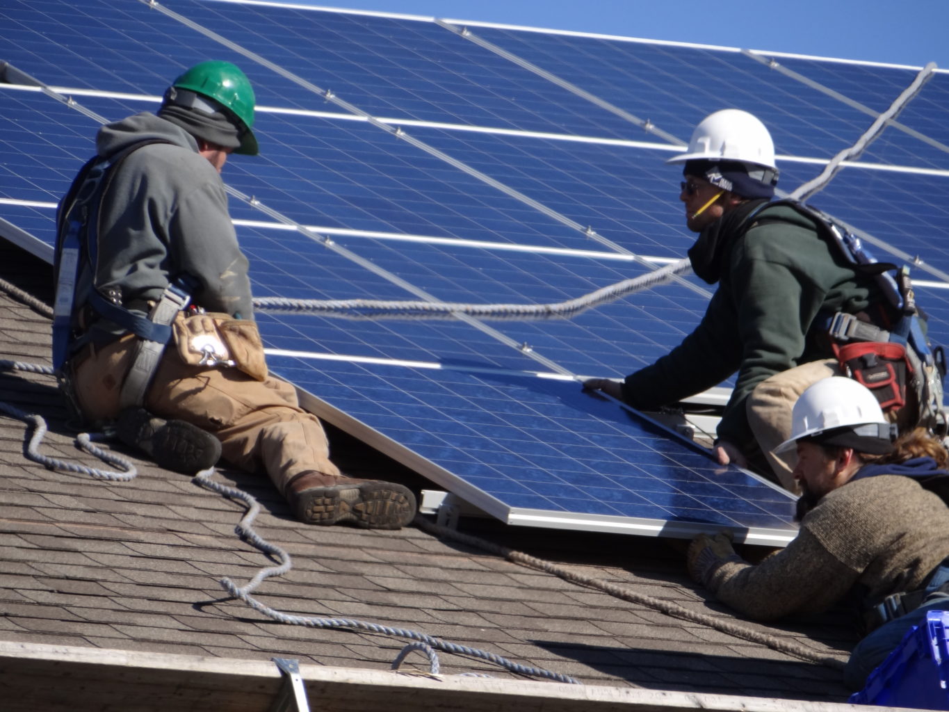 solar workers installing panels