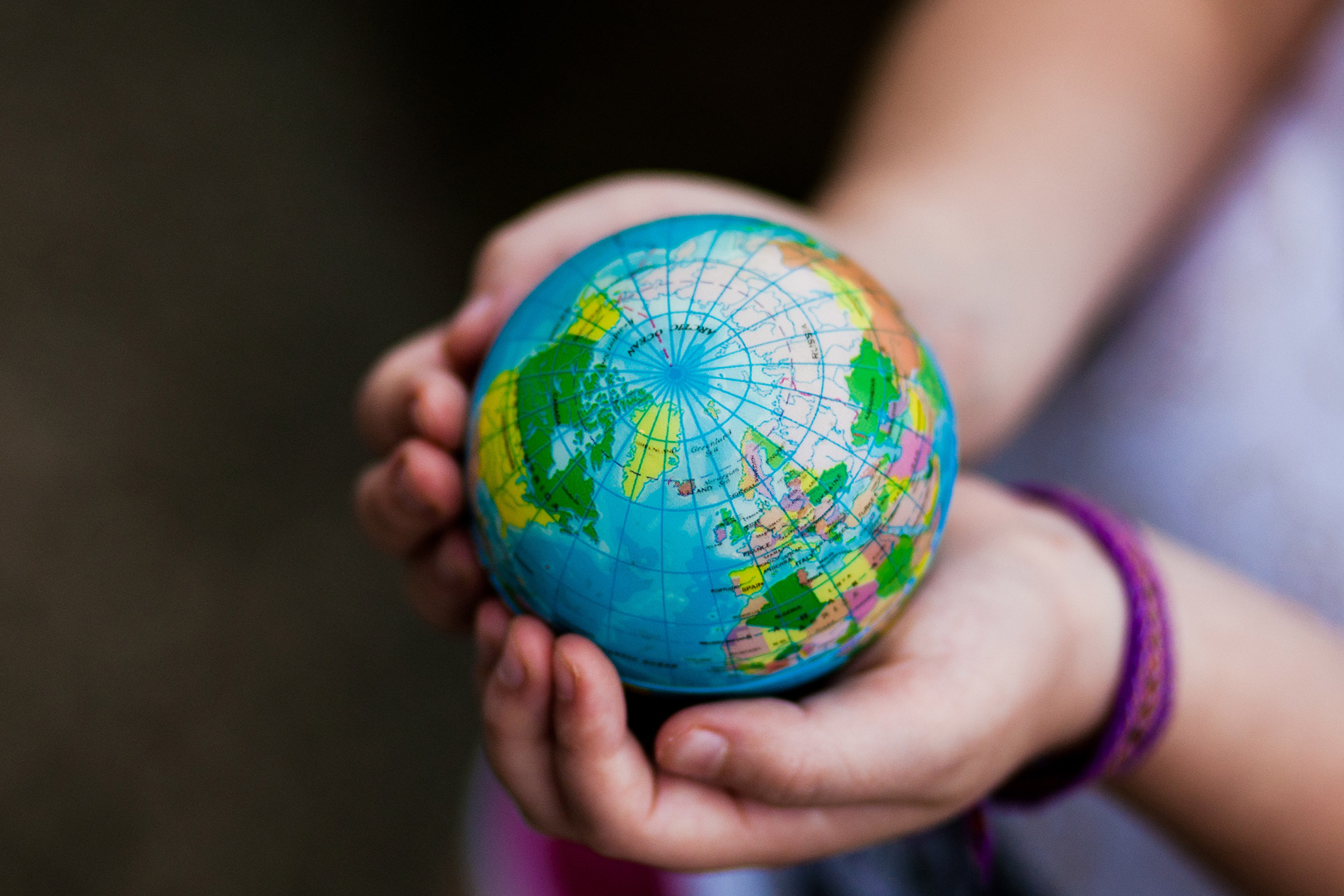 girl holding globe