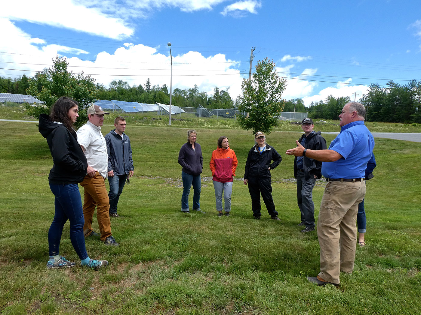 Superintendent Calvin Ames of Madison Electric Works speaks with NRCM staff during a recent visit.