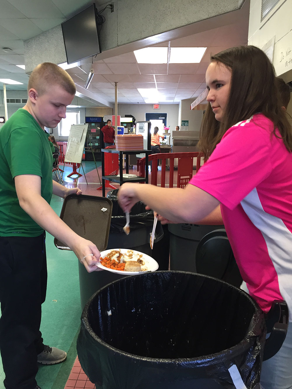 students helping compost food waste