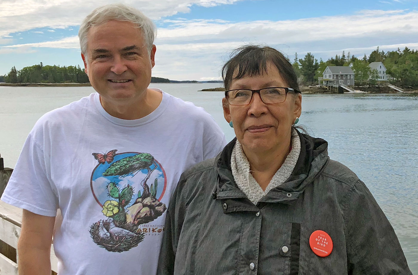 Jeff with Florence, visiting from the Northwest Territories and wearing her Year of the Bird pin, in front of the National Audubon Hog Island camp in Bremen, Maine. Courtesy of Jeff Wells