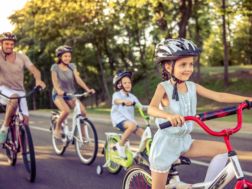 family riding bikes