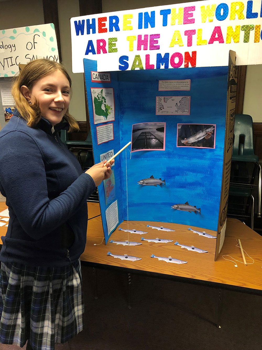 student with poster