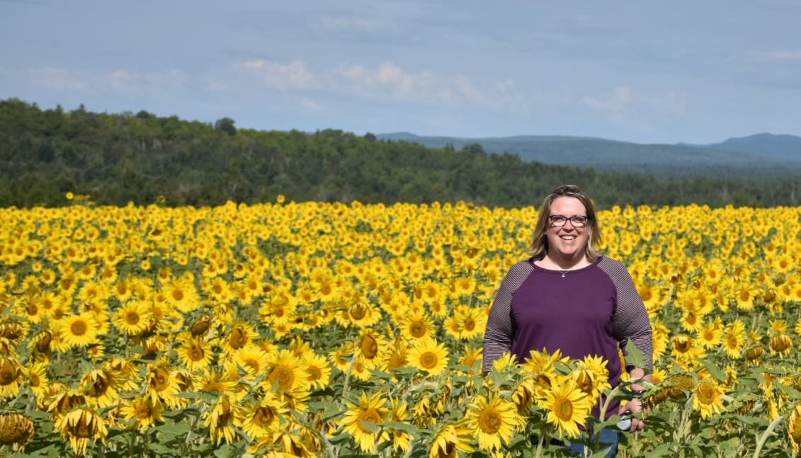 Beth in a sunflower field