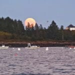 harvest moon over Maine coast