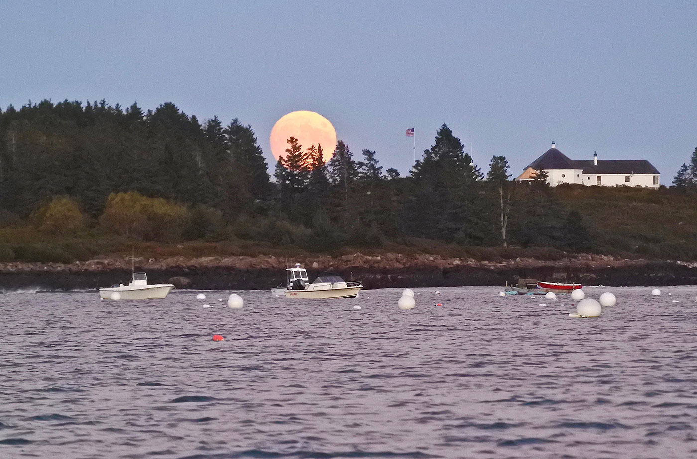 harvest moon over Maine coast