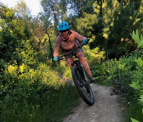 Mountain biking on wooded trail