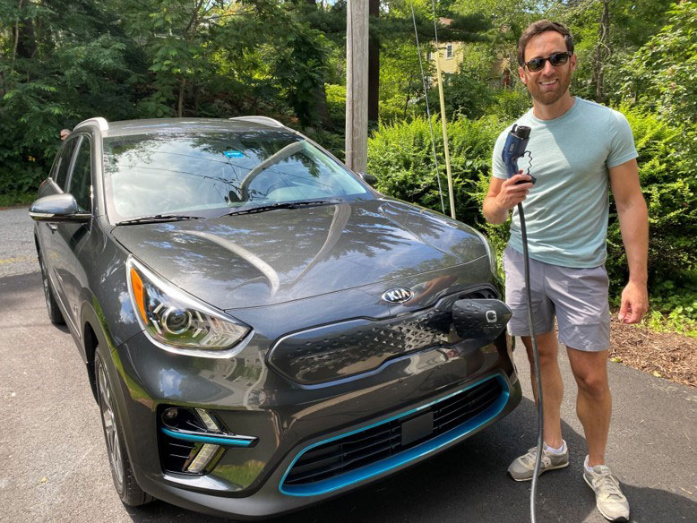 Keith Carson with his electric car