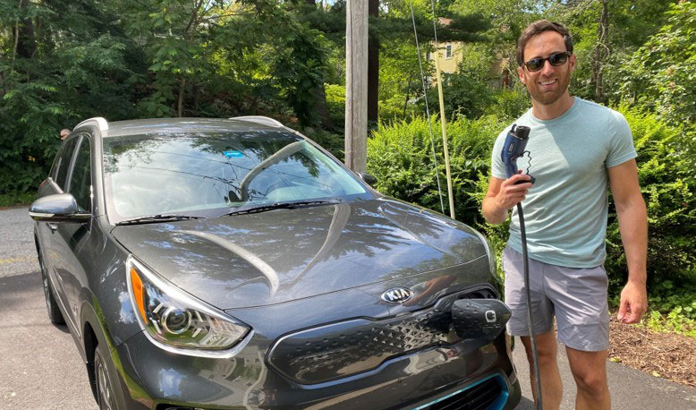 Keith Carson with his electric car