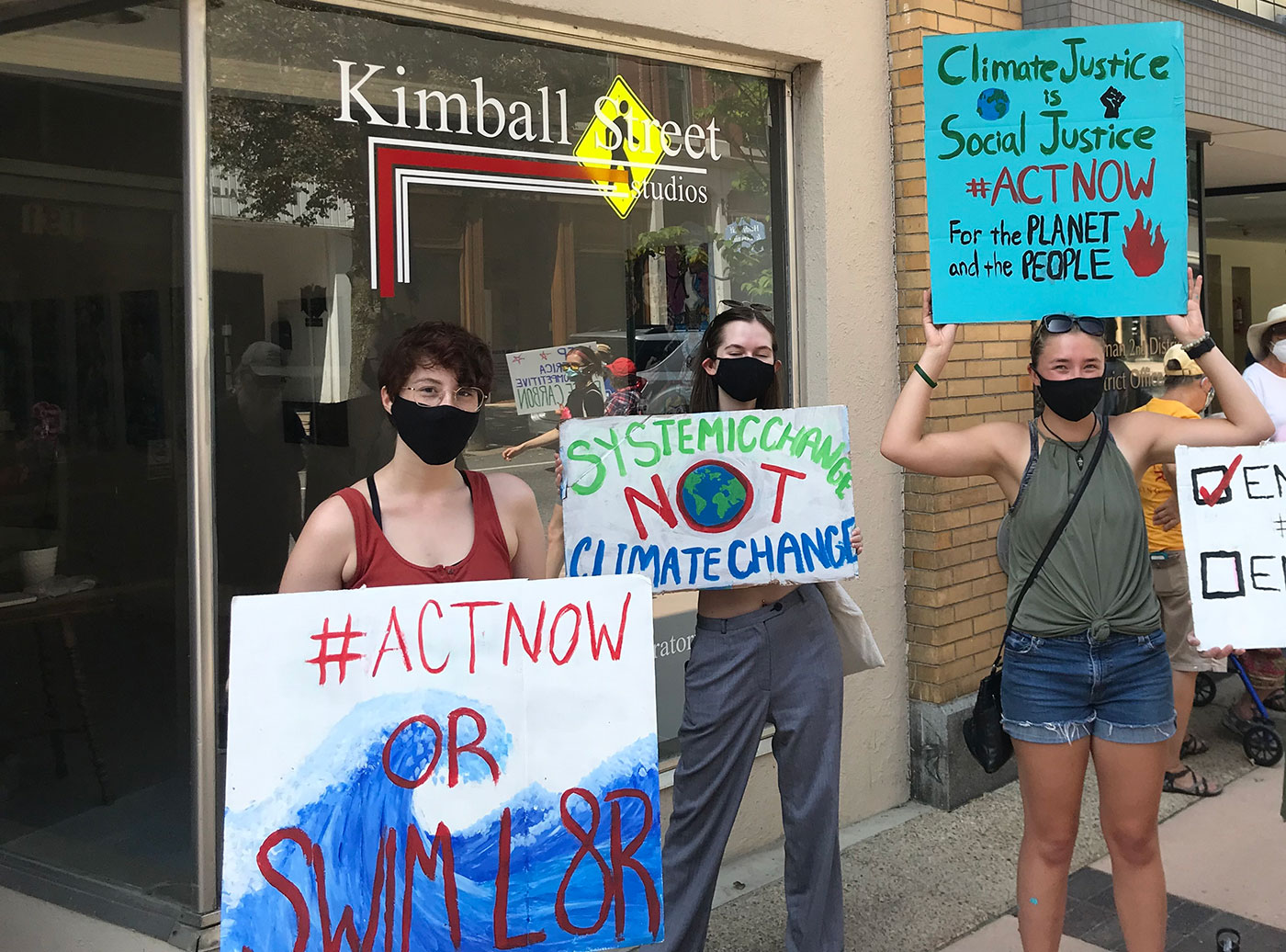 Mainers with signs outside Golden's office