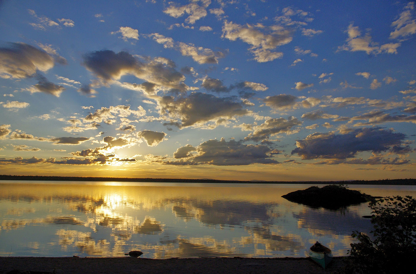 Lobster Lake with sun and clouds