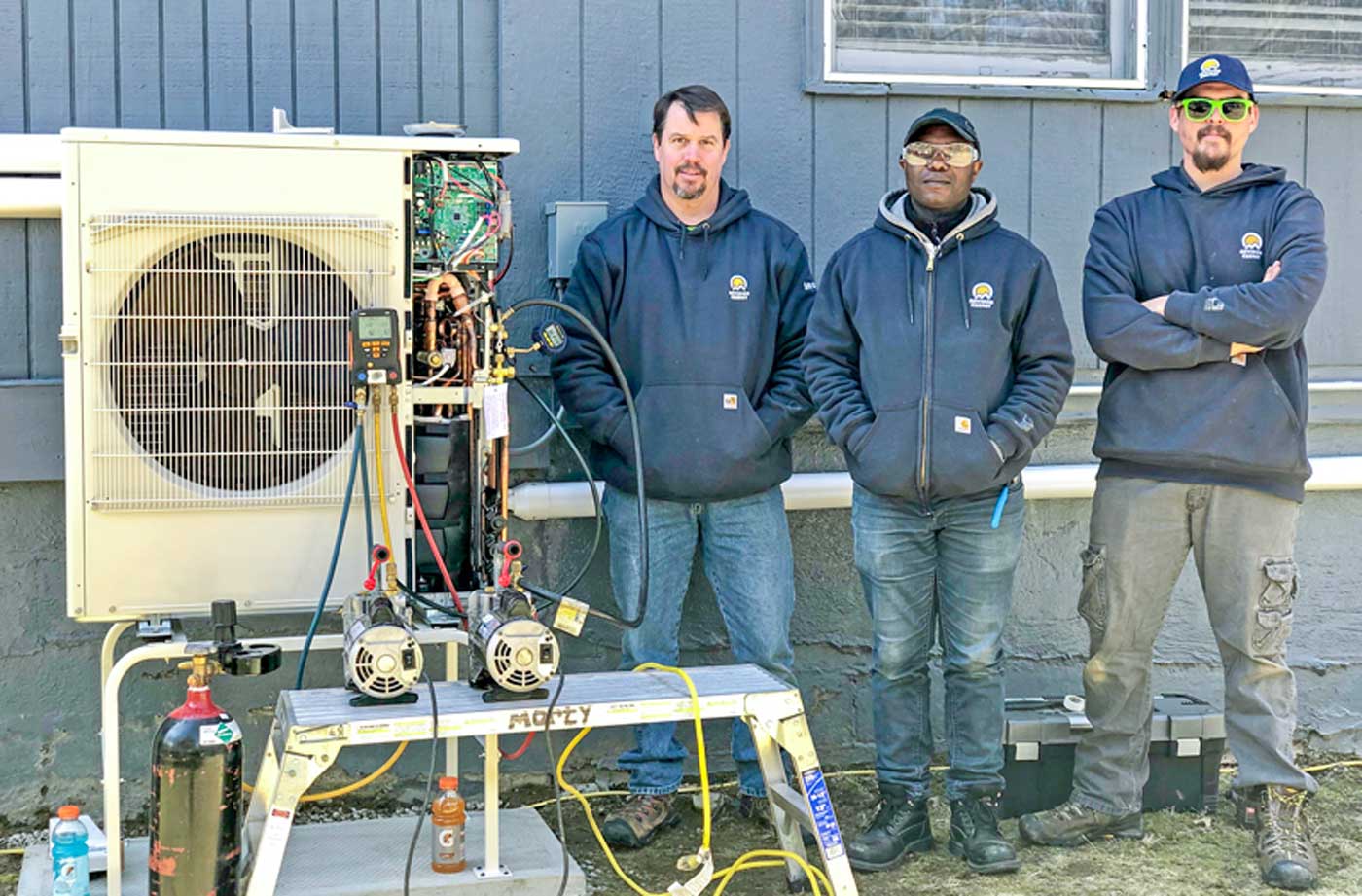 MA Thermal Crew next to heat pump