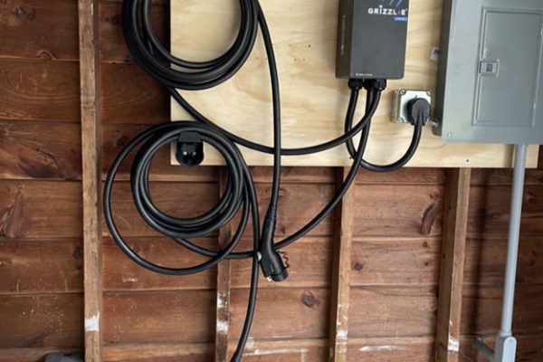 EV charger and wires in garage