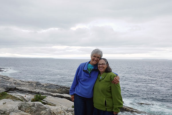 Lisa and Kathy standing on rocks at Pemaquid