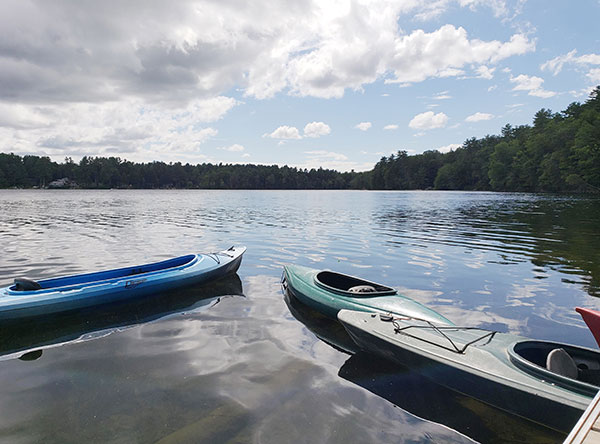 boats near dock in small Maine lake