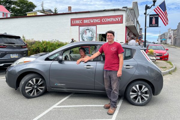 Lubec Brewing Company owners with their electric car