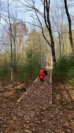 two children walking on path