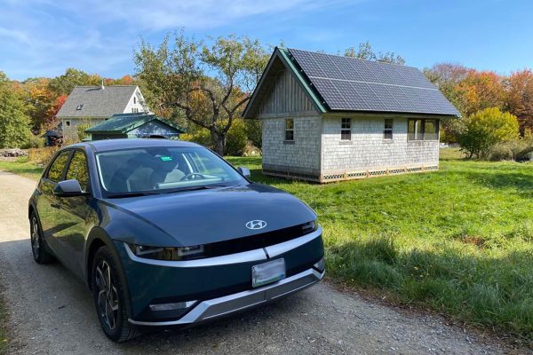 electric car and solar panels on roof