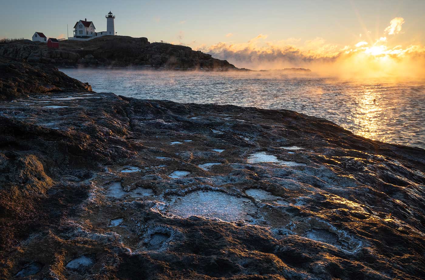 Nubble Light during sunrise in winter