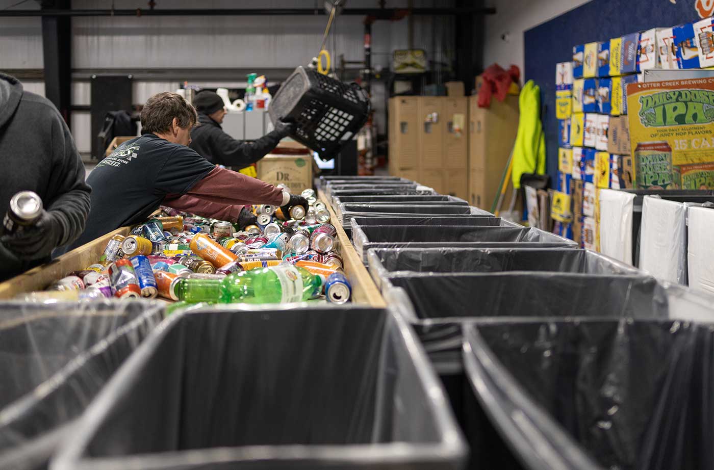 sorting bottles at redemption center