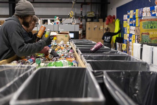 sorting bottles at redemption center