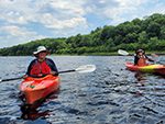 people kayaking on Kennebec River