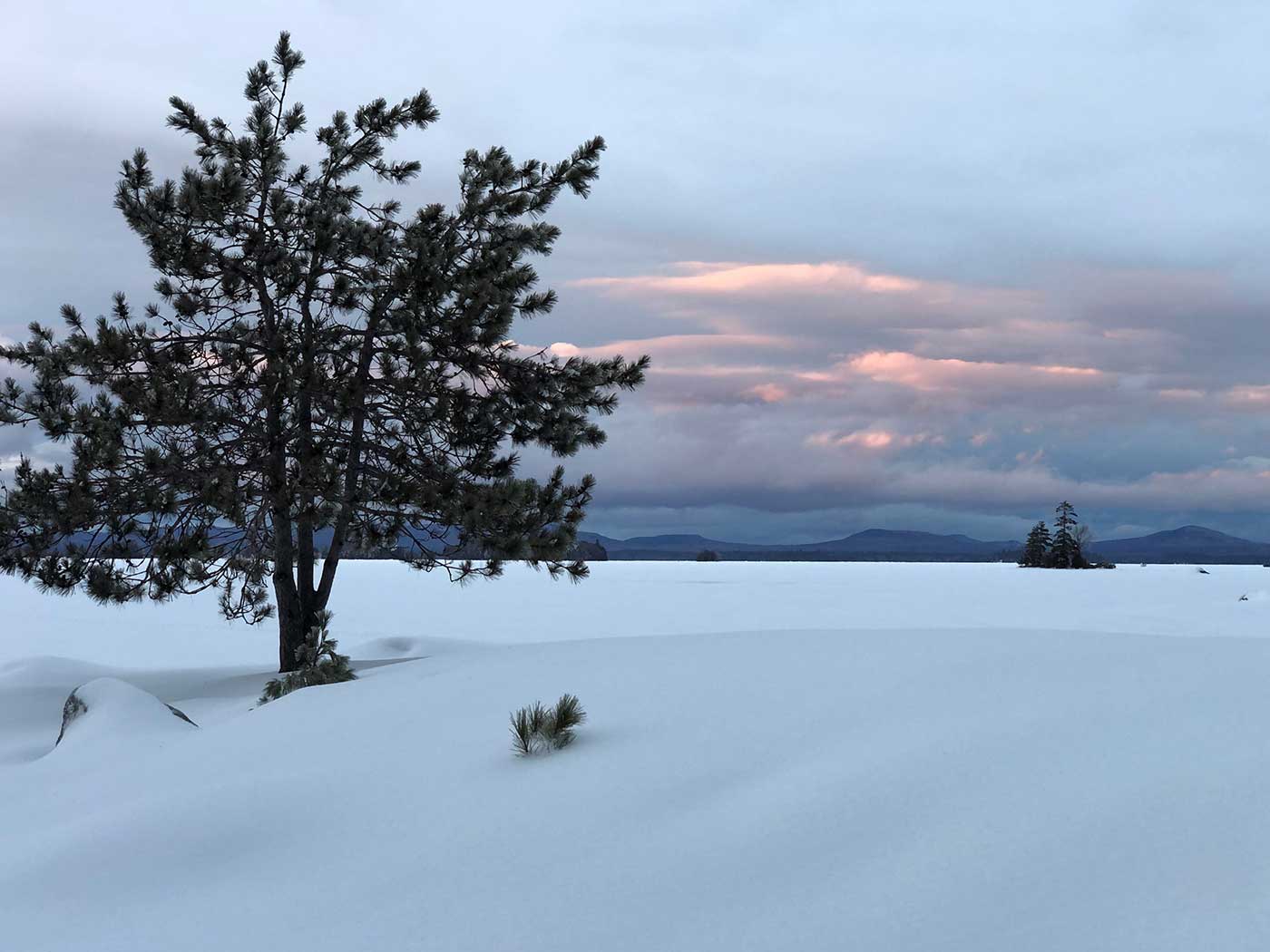 view of clouds over Katahdin taken from the New England Outdoor Center