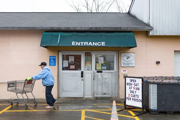 Employee in front of Portland Redemption Center.