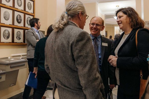 Rebeccah-Sanders-at-State-House-talking-with-members-and-legislators-SHAD-2023-AlyssaPereira-(3) NRCM staff speaking in hallway