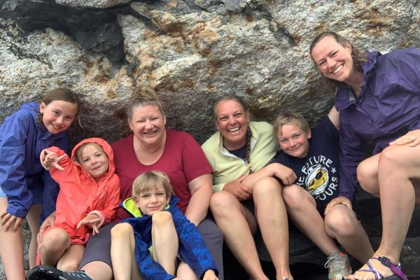 Alissa-Sarah-Tina-Pemaquid-2023 three women and their children sitting in front of rock