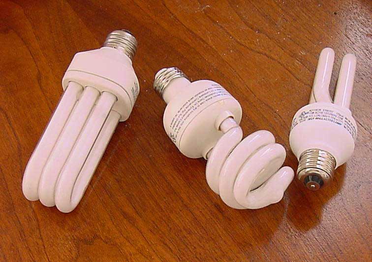 three CFL bulbs on tabletop