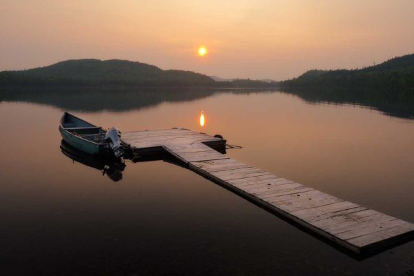 One of Bradford Camps’ docks and a smoky sunset