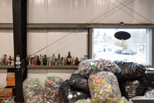 cans and bottles lined up at redemption center