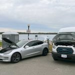 electric vehicles on display in parking lot