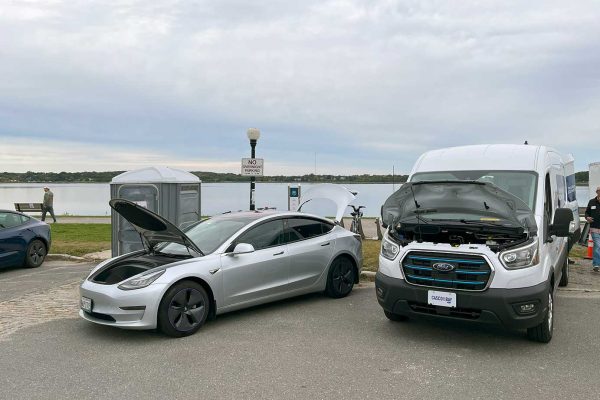 electric vehicles on display in parking lot
