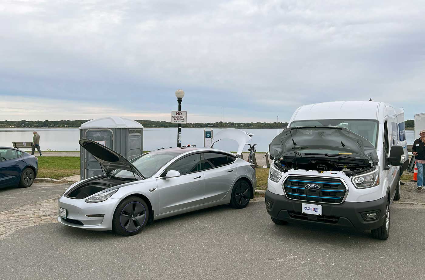 electric vehicles on display in parking lot