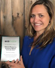 Sarah Nichols holding ecomaine award