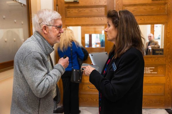 two people having conversation in State House