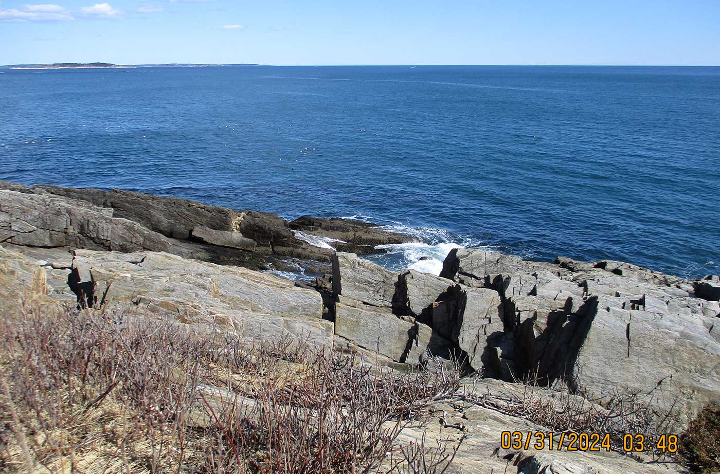 View of ocean from rocky trail