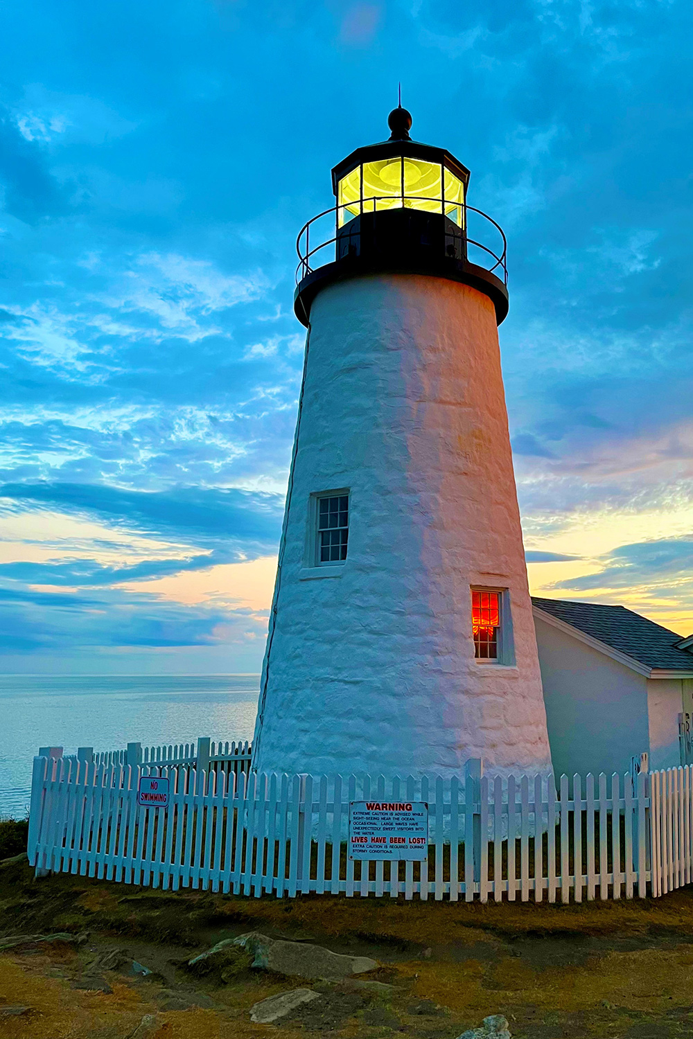 Pemaquid Light with window lit and beautiful sunset