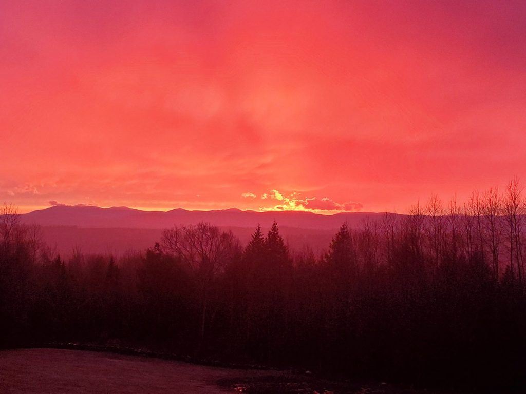 orange sky over mountains at sunset